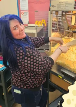 Picture of PTO member serving popcorn